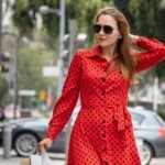 beautiful-woman-red-summer-dress-walking-joyfully-smiling-down-street-while-doing-shopping-carrying-her-bags