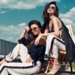 gorgeous-couple-brunette-women-fashion-dresses-posing-roof