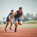 relay-race-men-with-baton-teamwork-speed-challenge-track-sports-event-arena-synergy-collaboration-athlete-partnership-running-competition-fitness-support-stadium