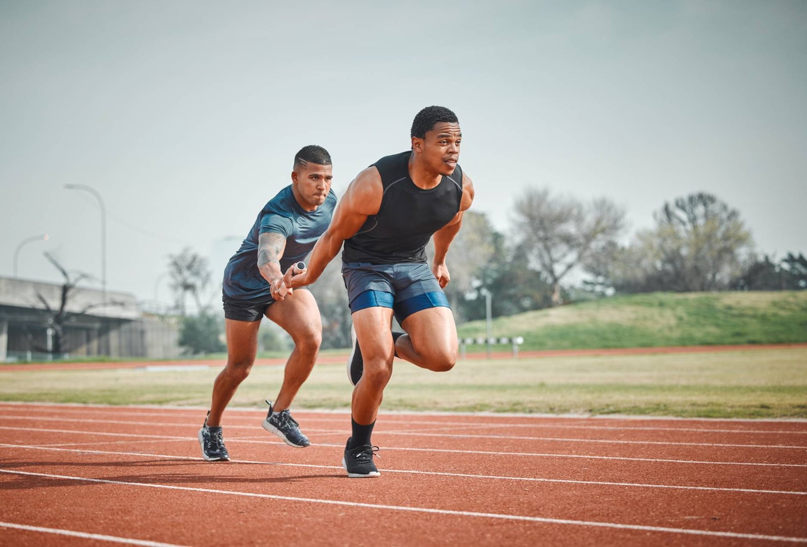 relay-race-men-with-baton-teamwork-speed-challenge-track-sports-event-arena-synergy-collaboration-athlete-partnership-running-competition-fitness-support-stadium